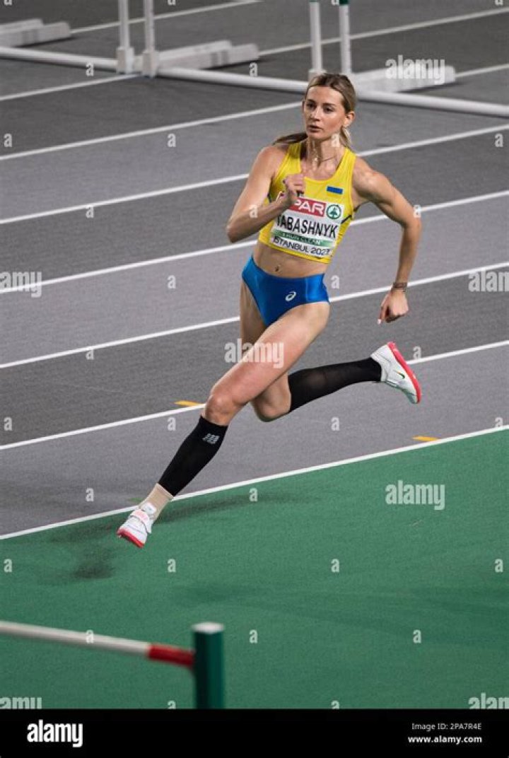 Kateryna Tabashnyk of Ukraine (R) and her coach during high jump women