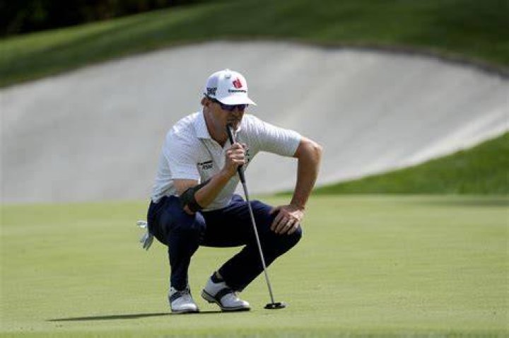 Masters champion Zach Johnson hits his tee shot on hole No. 2 during