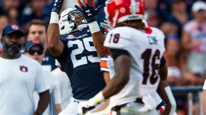 Receiver Caylin Newton catches a pass during drills during Auburn Pro