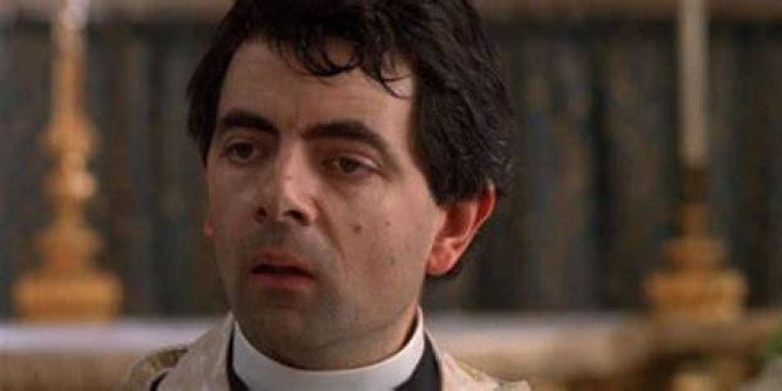 Rowan Atkinson as Father Gerald in Four weddings and a Funeral Johnny