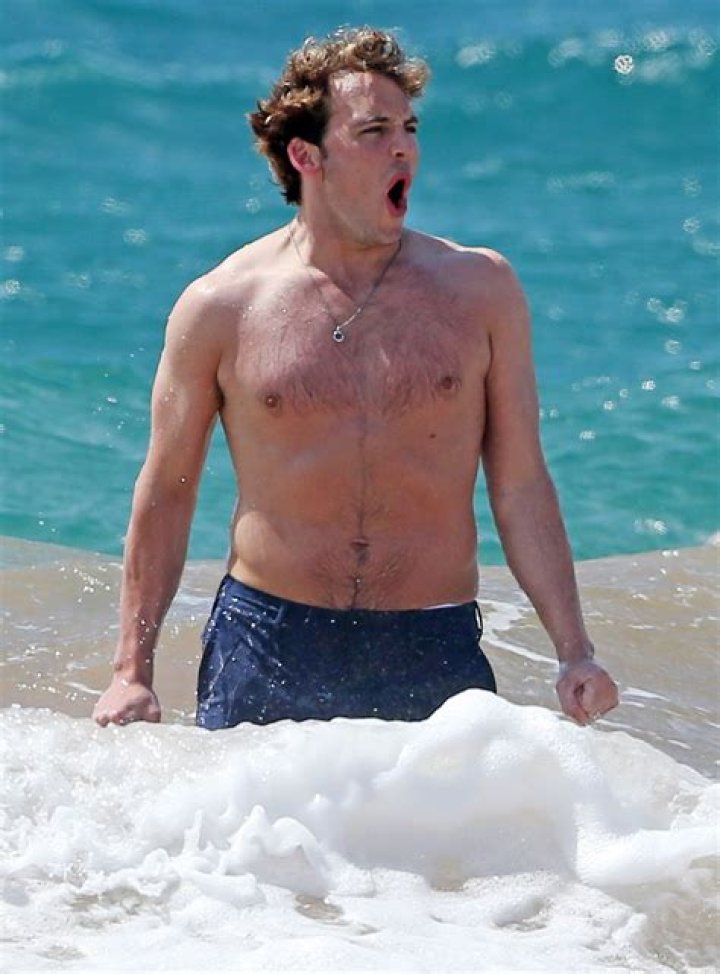 Shirtless Sam Claflin Frolics on Hawaiian Beach with Wife Laura Haddock