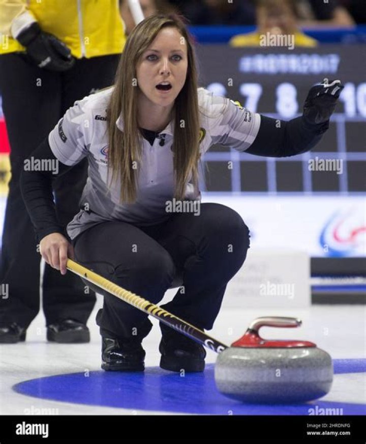 Skip Rachel Homan, from Ottawa, Ont. kisses her husband Shawn Germain
