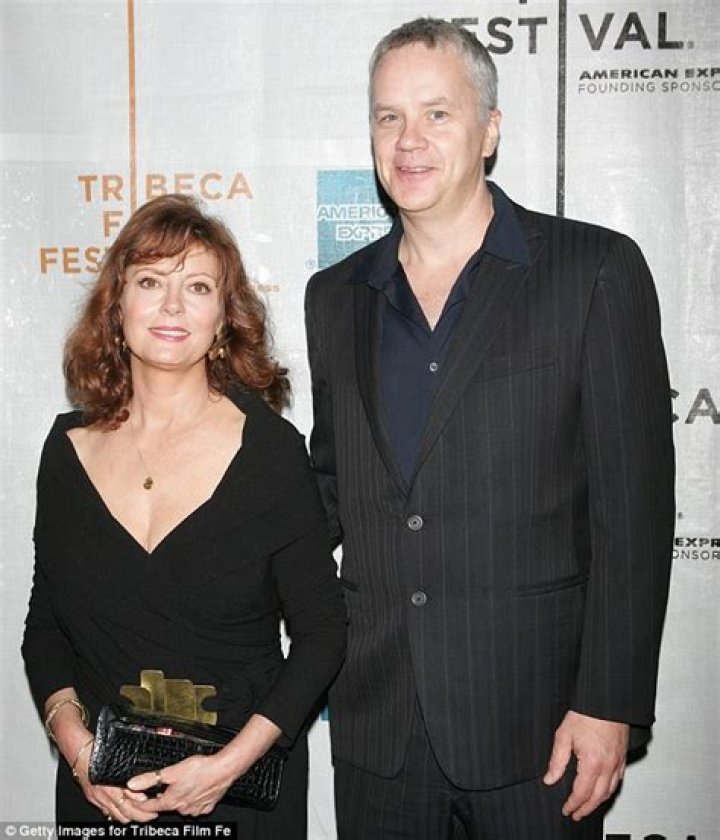 Tim Robbins takes romantic stroll holding hands with younger looking